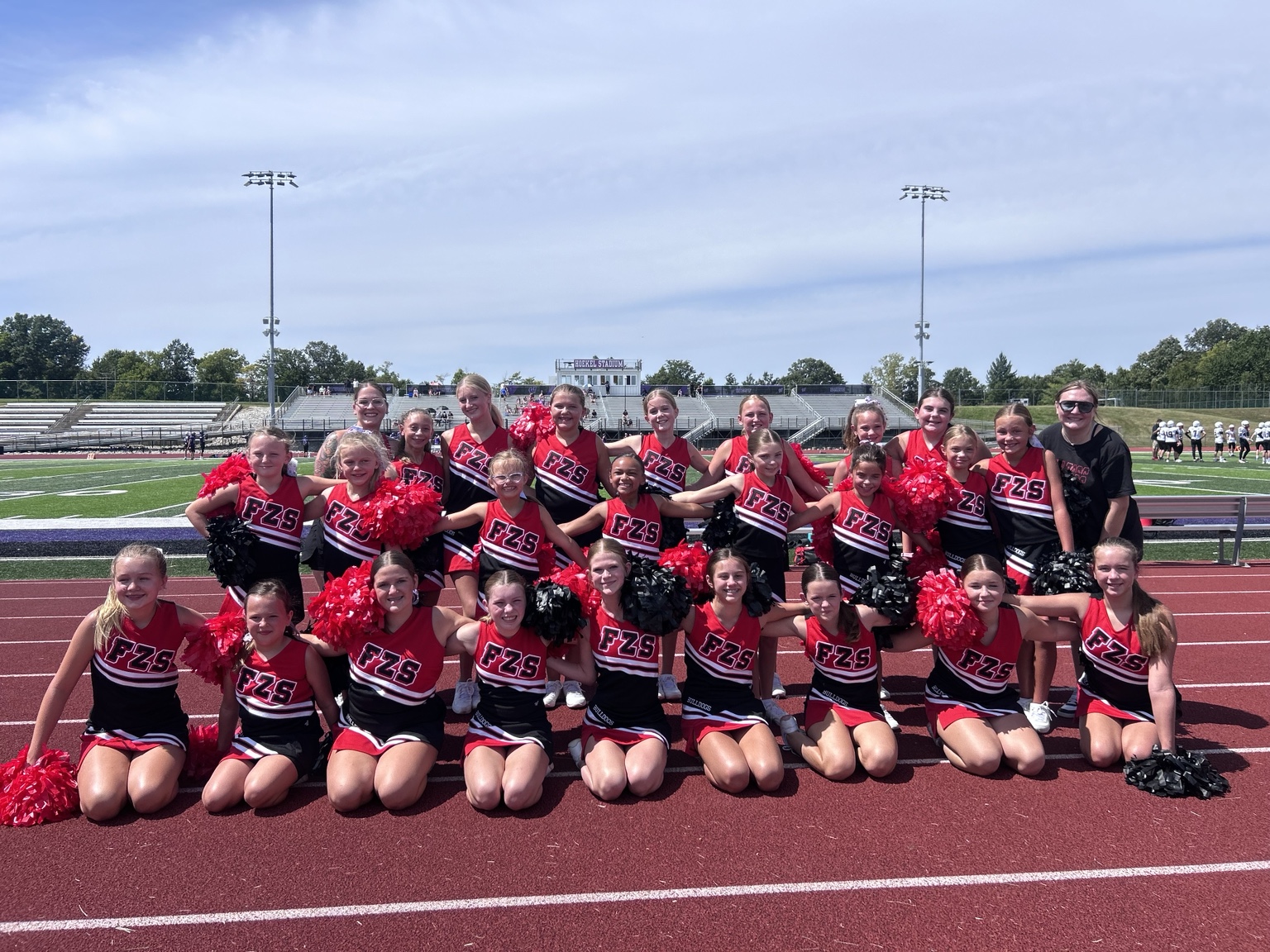 Candice Hathorn with her Junior Bulldogs Cheer team